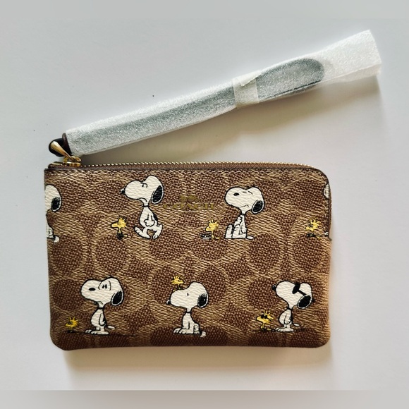 Coach Handbags - BNWT COACH X PEANUTS CORNER ZIP WRISTLET SIGNATURE CANVAS - SNOOPY & WOODSTOCK